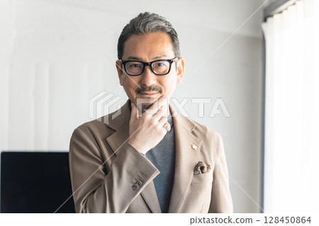 Senior male portrait 128450864