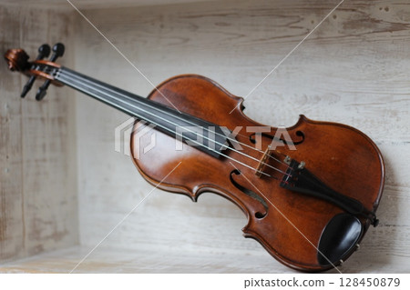 violin - an orchestral or solo professional bowed musical instrument with four strings. loved by children and adults. used in classical folk popular and jazz music 128450879