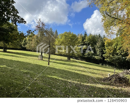 Blue sky with cloudy weather, nature cloud over the landskape. Beauty cloud against a blue sky background. Sky slouds. Over the land white clouds, blue sky 128450903