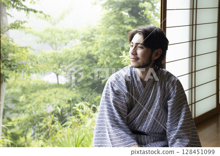 Foreign man relaxing at a hot spring inn Foreign man relaxing at a hot spring inn 128451099