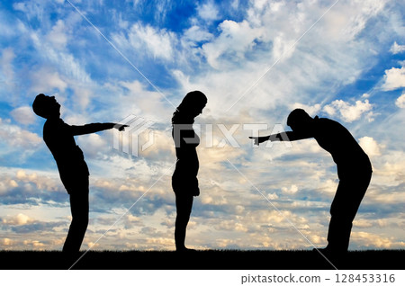 Silhouettes of two men laughing at a woman showing a finger at her 128453316