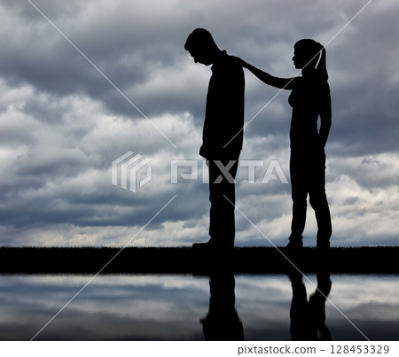 A silhouette of a woman morally supports a sad man A silhouette of a woman morally supports a sad man 128453329