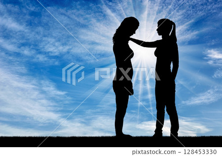 A silhouette of a woman morally supports another woman A silhouette of a woman morally supports another woman 128453330