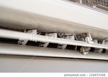 Mold on air conditioner close-up. Air conditioner maintenance and cleaning. Mold on air conditioner close-up. Air conditioner maintenance and cleaning. 128453388