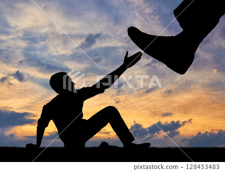 Silhouette of a large leg pressing on a man asking for help Silhouette of a large leg pressing on a man asking for help 128453483