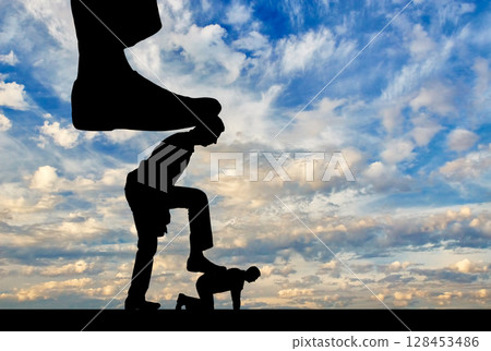 Silhouette of a large leg presses on a man Silhouette of a large leg presses on a man 128453486