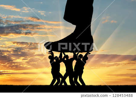The silhouette of a large leg presses on a crowd of people that resists it 128453488