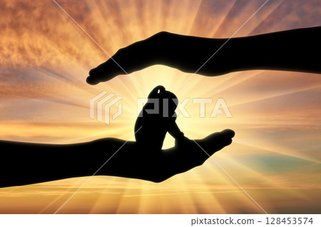 Little girl baby crying sitting in big hands 128453574