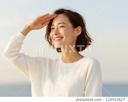A woman's smile expressing positive feelings 128453627