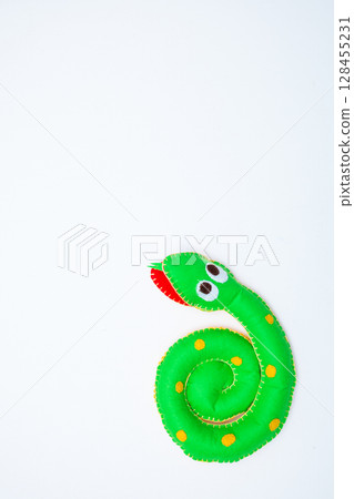 Happy hand made worm. Helminth made of different colors felt. Safe eco stuffed toy for infants and toddlers. Caterpillar body connectable with velcro Happy hand made worm. Helminth made of different colors felt. Safe eco stuffed toy for infants and toddlers. Caterpillar body connectable with velcro 128455231