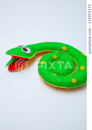 Happy hand made worm. Helminth made of different colors felt. Safe eco stuffed toy for infants and toddlers. Caterpillar body connectable with velcro Happy hand made worm. Helminth made of different colors felt. Safe eco stuffed toy for infants and toddlers. Caterpillar body connectable with velcro 128455233