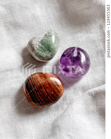Three colorful natural stones AI image 128455363