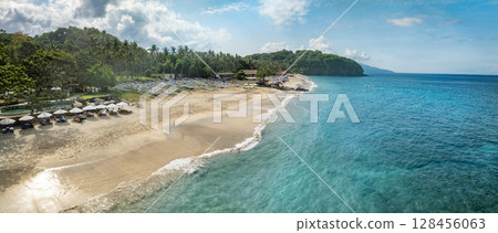Top Aerial view of famous Virgin Beach in Bali, Indonesia. Empty paradise beach, blue sea waves in Bali island, Indonesia 128456063