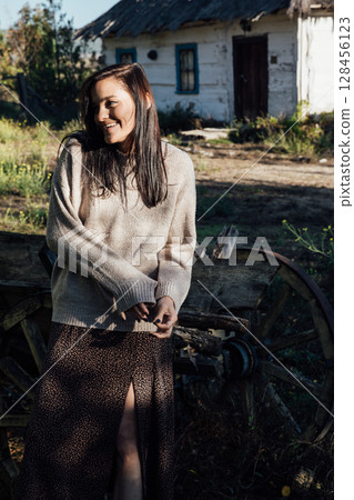 Portrait of Beautiful Woman in Autumn Clothes in Village Portrait of Beautiful Woman in Autumn Clothes in Village 128456123