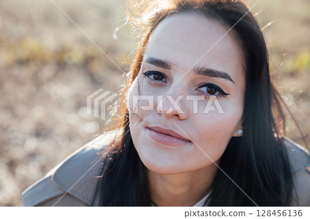 Portrait of a beautiful fashionable brunette woman face Portrait of a beautiful fashionable brunette woman face 128456136