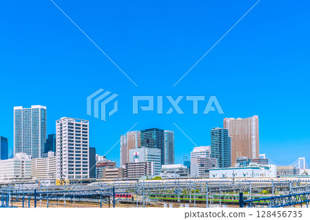 Tokyo cityscape in Japan - View of the Shinkansen and tower apartment complexes in Shibaura, including Shibaura Island Cape Tower 128456735