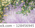Yellow bank roses blooming against a background of spring wisteria flowers 128456945