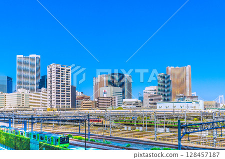 Tokyo cityscape in Japan: View of the Shinkansen, Yamanote Line, and tower apartment complexes in Shibaura, including Shibaura Island Cape Tower Tokyo cityscape in Japan: View of the Shinkansen, Yamanote Line, and tower apartment complexes in Shibaura, including Shibaura Island Cape Tower 128457187