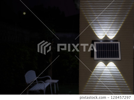 Outdoor Solar LED Wall Light at Night 128457297