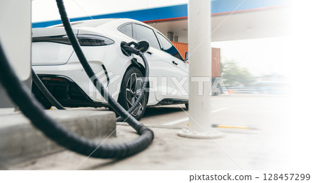 Electric car charging with station, EV fuel advance an modern eco system. Electric car charging with station, EV fuel advance an modern eco system. 128457299