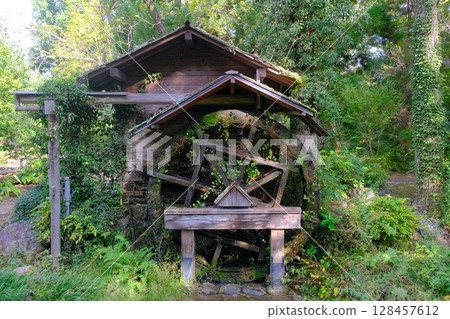 Old wooden watermill 128457612