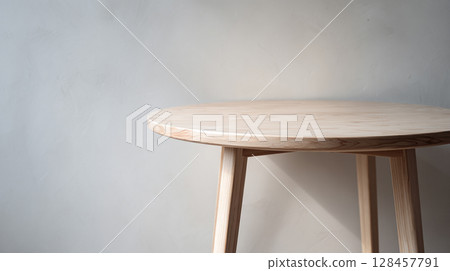 A warm wooden round table that creates a minimalist space A warm wooden round table that creates a minimalist space 128457791