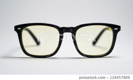 Black-rimmed glasses with pale yellow lenses 128457809