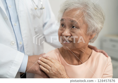 Caregiver holding hands Asian elderly woman patient with love, care, encourage and empathy at nursing hospital, healthy strong medical. Caregiver holding hands Asian elderly woman patient with love, care, encourage and empathy at nursing hospital, healthy strong medical. 128457876