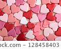 Assorted heart decorations in pink, red and white tones. 128458403