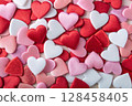 Textured heart decorations in red, pink and white tones. 128458405