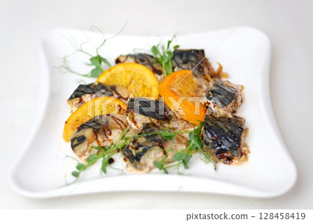 Raw stuffed fish close up. Dorado preparation, spices and oil. 128458419