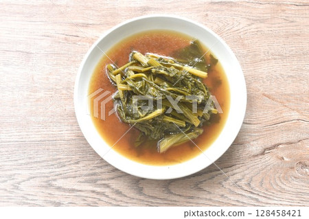 boiled spanich in sesame oil soup Chinese food on plate 128458421