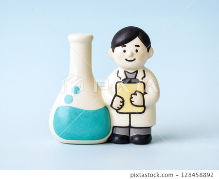 Researcher with a large flask Researcher with a large flask 128458892