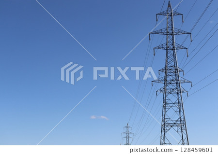 Tower rising in the blue sky 128459601