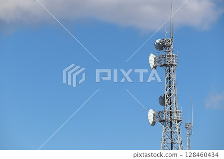Radio tower towering in the blue sky Radio tower towering in the blue sky 128460434