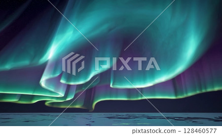 Vibrant green and purple aurora borealis dancing across calm water, illuminating dark polar landscape with mesmerizing luminescent glow 128460577