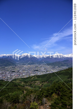 Omachi city and the Northern Alps as seen from Mount Takagari 128461089