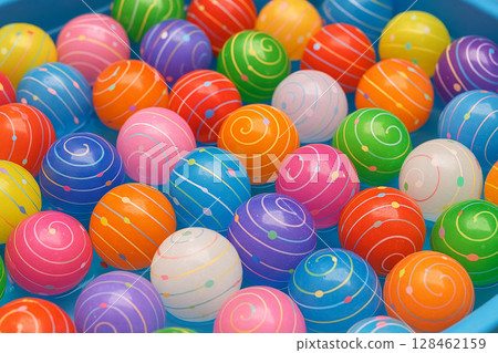 Children in yukata enjoying yo-yo scooping at a summer festival 128462159