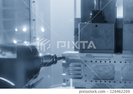 The horizontal CNC milling machine cutting the aluminum automotive parts by solid flat nose end mill tool in the light blue scene. 128462209