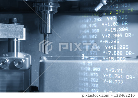 Abstract scene the CNC milling machine finish cut the aluminum housing parts and G-code data background in the blue tone. 128462210