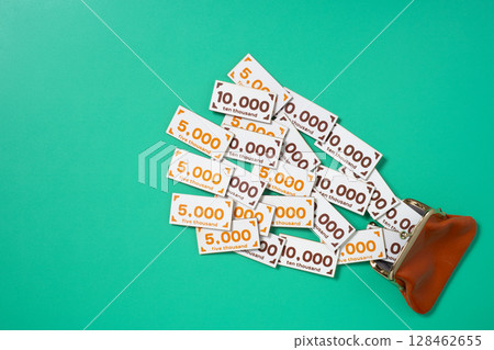 Toy money that jumps into or out of your wallet 128462655