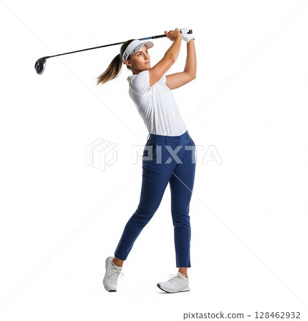 Full-body portrait of a female golfer concentrating on swinging a golf ball White background 128462932