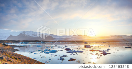 Excellent  landscape with floating icebergs in Jokulsarlon glacier lagoon at sunset. 128463248