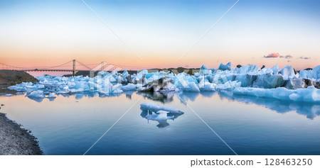 Excellent  landscape with floating icebergs in Jokulsarlon glacier lagoon at sunset. 128463250