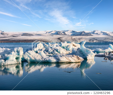 Ramarkable floating icebergs in Jokulsarlon glacier lagoon. Ramarkable floating icebergs in Jokulsarlon glacier lagoon. 128463296