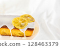 Lemon cake with icing on white background 128463379