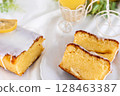 Cross section of a cut lemon cake (fluffy baked confectionery, white background) 128463387