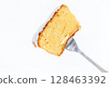 Cross-section of an iced lemon cake pierced with a fork (soft texture/refreshing sweet) 128463392