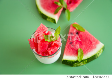Morning yogurt and watermelon slices with mint on the table Morning yogurt and watermelon slices with mint on the table 128463445