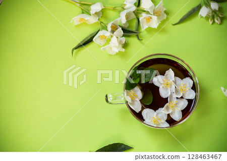 Tea composition with green tea and jasmine flowers 128463467